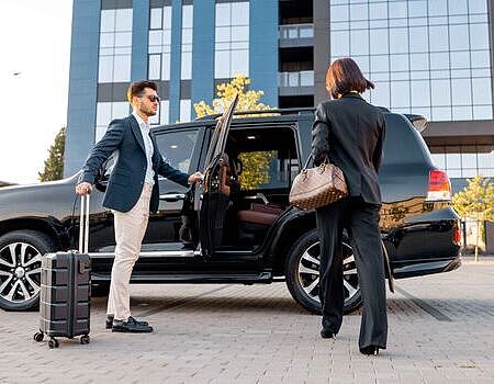 business-couple-travel-by-car
